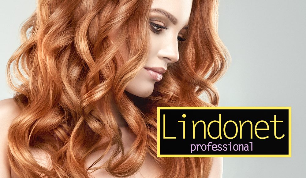 Beautiful model girl with long red curly hair .Red head . Care a